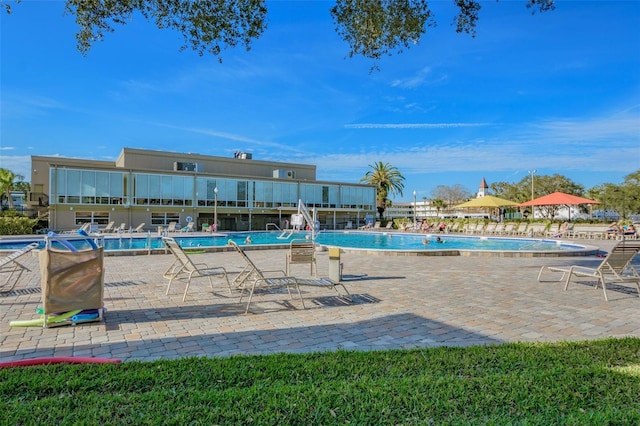 view of swimming pool featuring a patio area