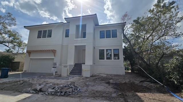 view of front of home featuring a garage and concrete driveway