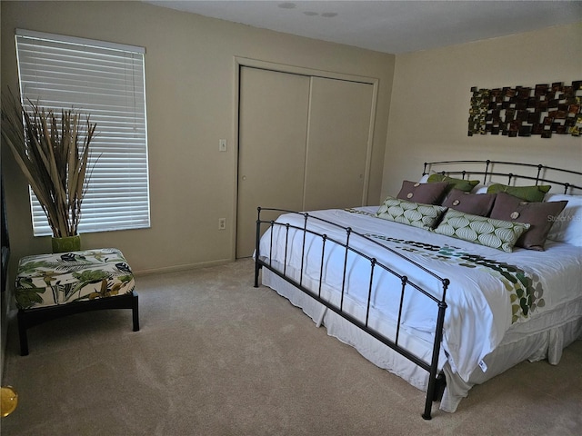 carpeted bedroom with a closet