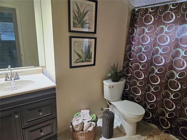 bathroom with toilet and vanity