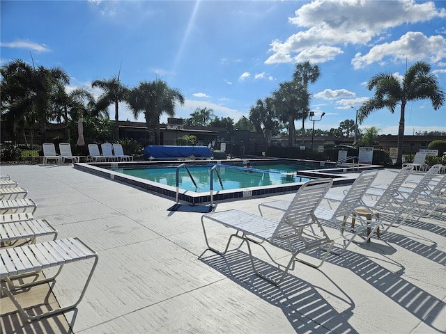 view of swimming pool with a patio area