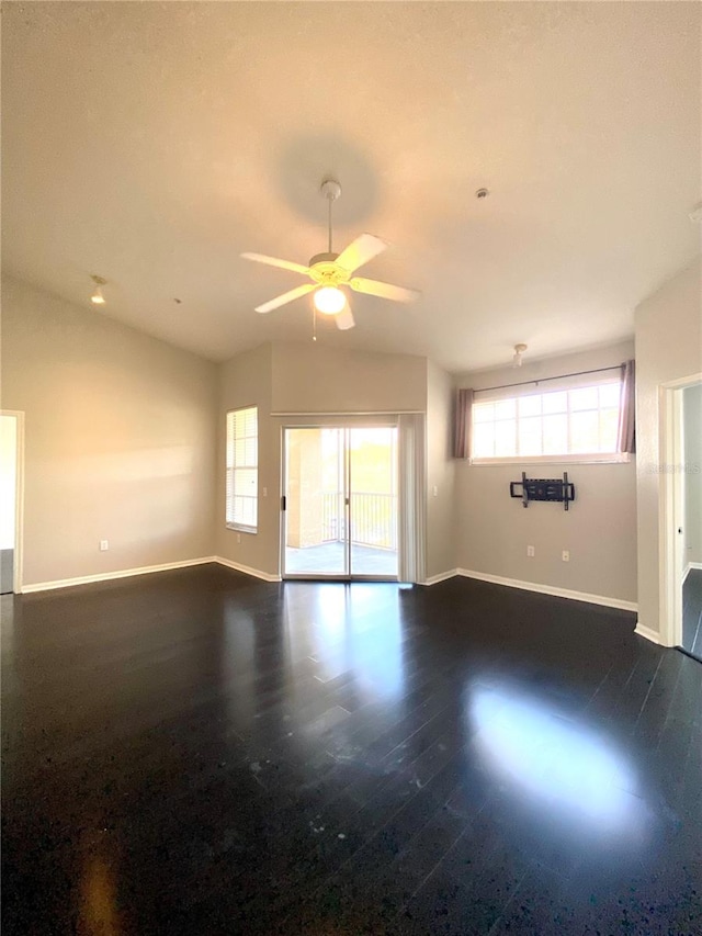 spare room featuring dark hardwood / wood-style floors and ceiling fan