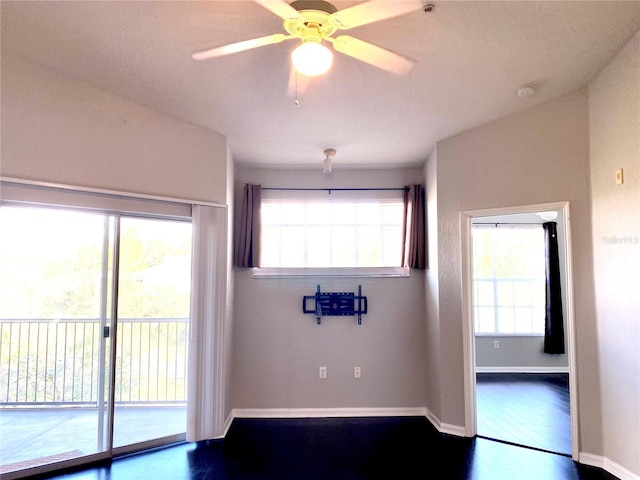 unfurnished room featuring hardwood / wood-style flooring and ceiling fan