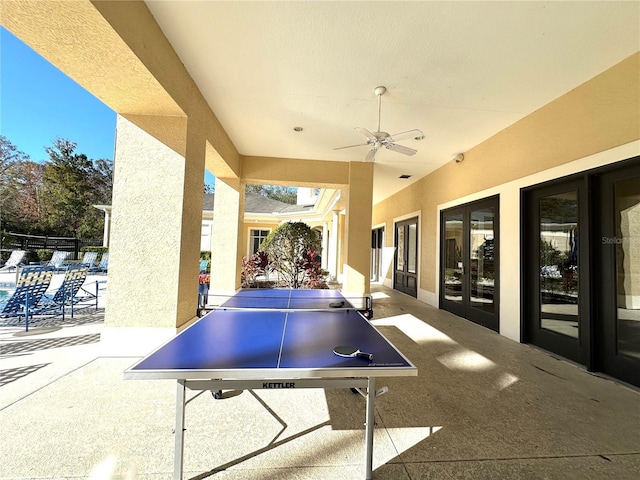 view of patio with french doors and ceiling fan