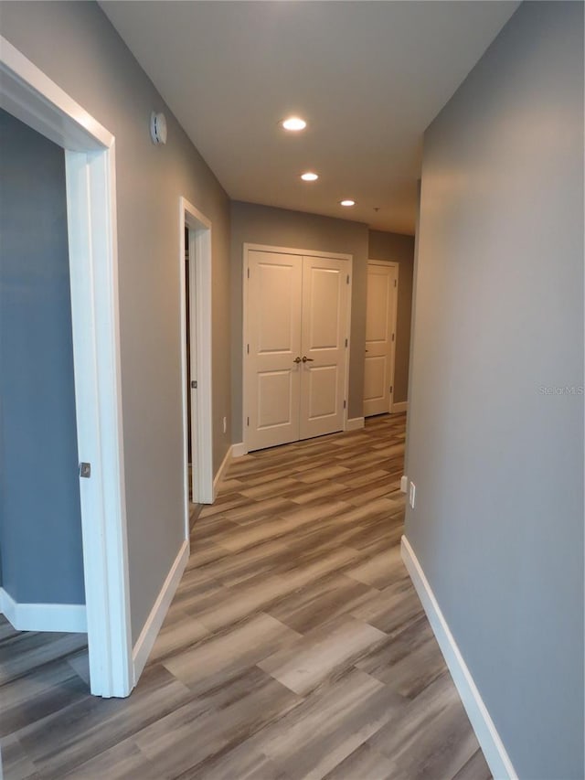 corridor featuring light hardwood / wood-style flooring