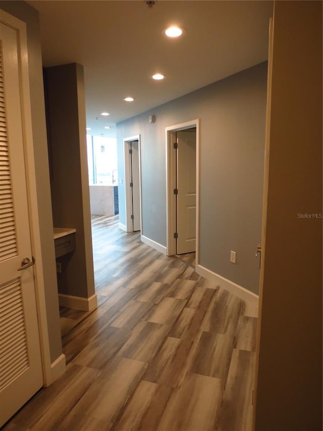 corridor featuring hardwood / wood-style floors