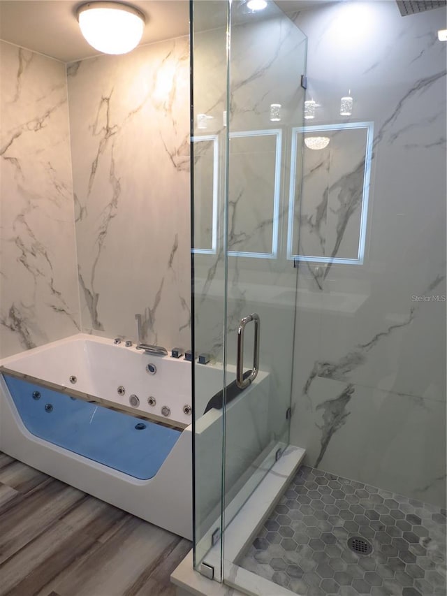 bathroom featuring hardwood / wood-style floors and an enclosed shower