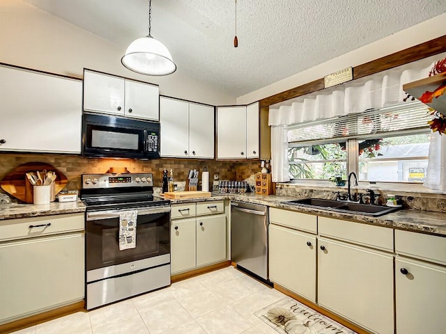 kitchen with pendant lighting, sink, stainless steel appliances, light tile flooring, and tasteful backsplash