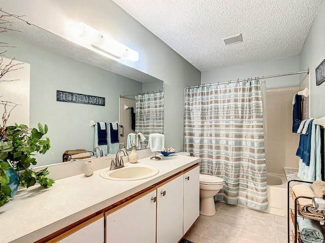 full bathroom with toilet, shower / bath combo with shower curtain, tile floors, a textured ceiling, and vanity