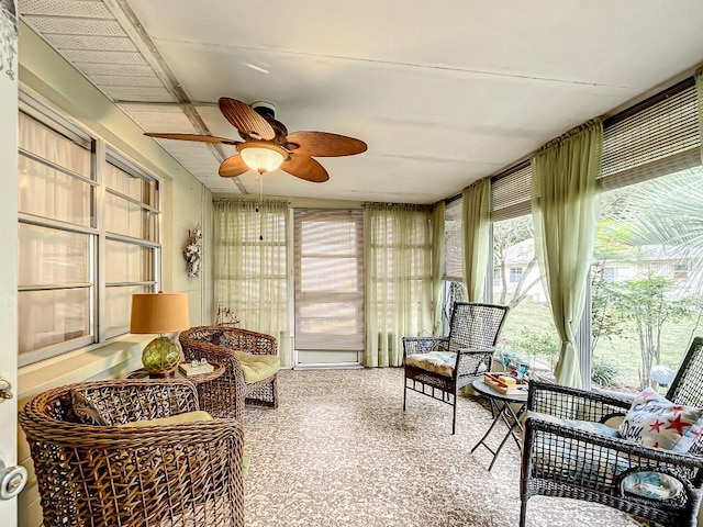 sunroom featuring ceiling fan and a wall unit AC