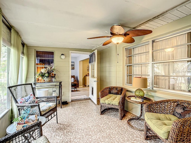 sunroom with ceiling fan and a wealth of natural light