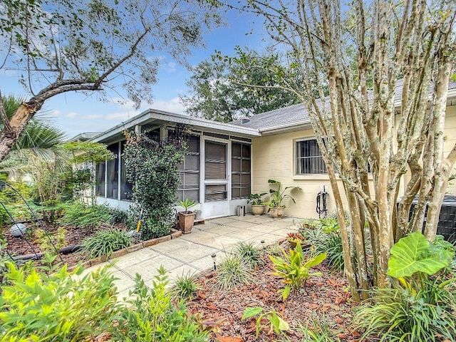 view of front facade with a sunroom