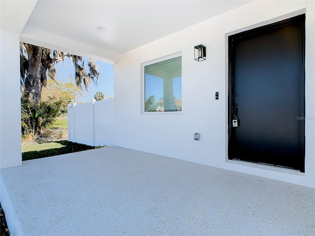 doorway to property with a patio area