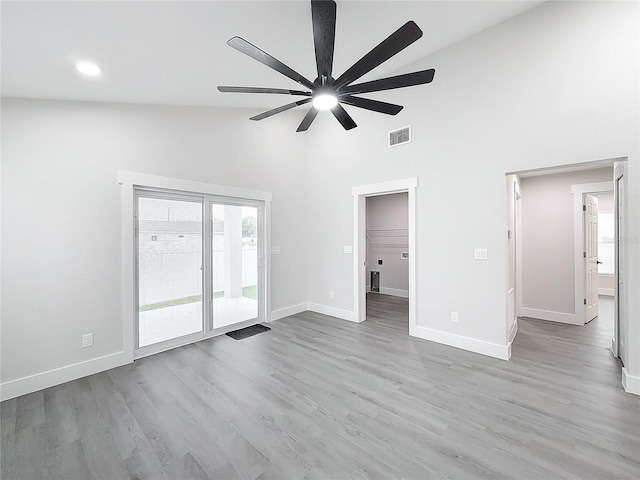 interior space featuring ceiling fan, light hardwood / wood-style floors, and high vaulted ceiling