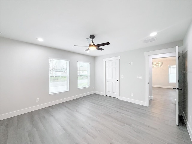 unfurnished bedroom featuring ceiling fan and light wood-type flooring