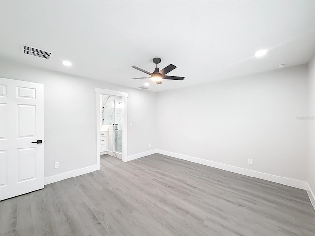 unfurnished room with ceiling fan and hardwood / wood-style floors