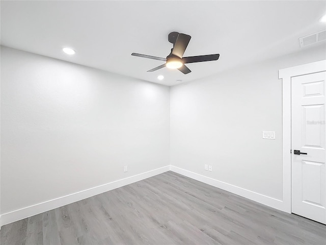 empty room with light hardwood / wood-style floors and ceiling fan