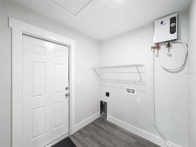 laundry room with hookup for a washing machine, dark hardwood / wood-style floors, and water heater