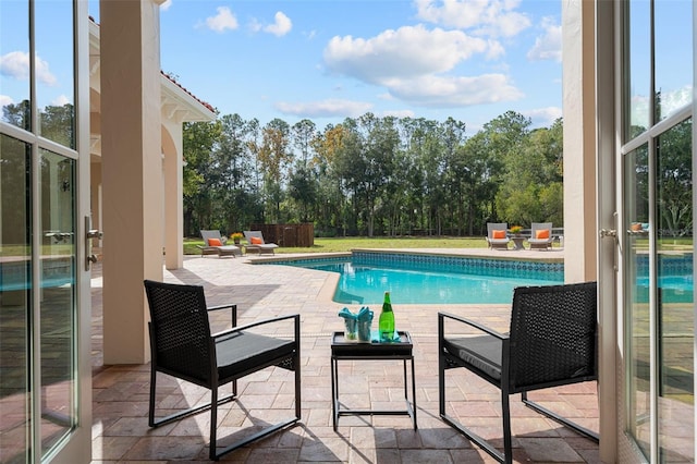 view of swimming pool with a patio area