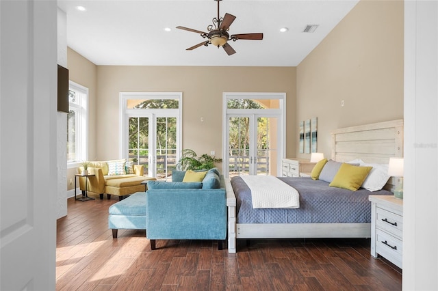 bedroom with ceiling fan, dark hardwood / wood-style floors, access to outside, and french doors