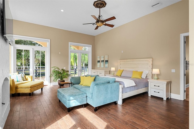 bedroom with ceiling fan, dark hardwood / wood-style floors, access to outside, and french doors