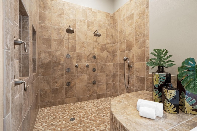 bathroom featuring a tile shower