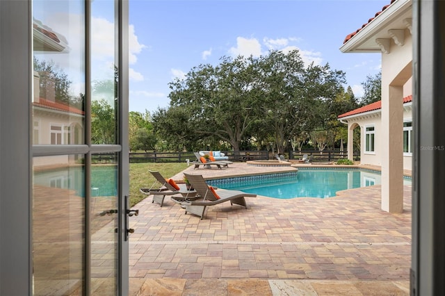 view of pool featuring a patio