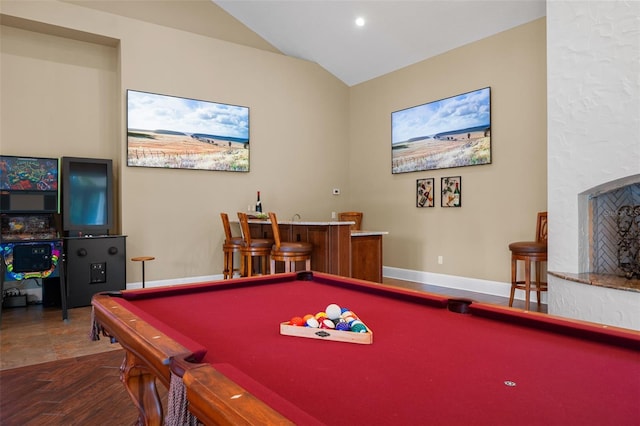 game room featuring hardwood / wood-style flooring, indoor bar, vaulted ceiling, and pool table