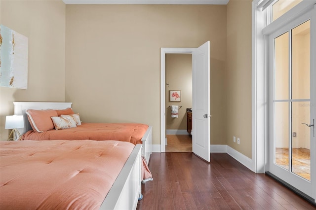 bedroom with dark hardwood / wood-style floors