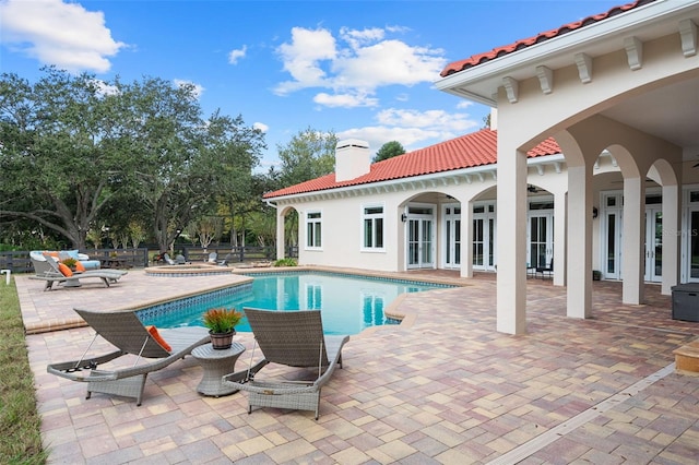 view of swimming pool featuring a patio