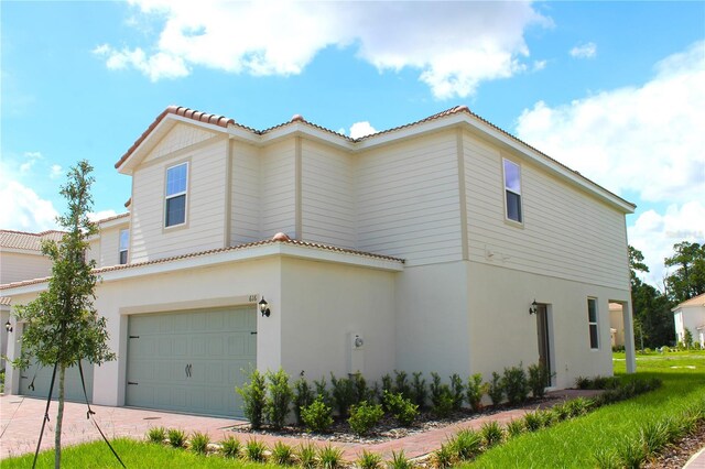 view of property exterior with a garage