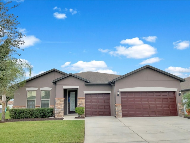 ranch-style home featuring a front lawn and a garage