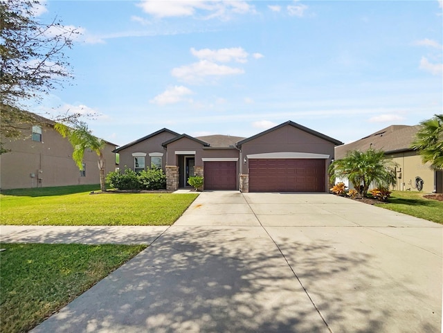 ranch-style home featuring a front yard and a garage