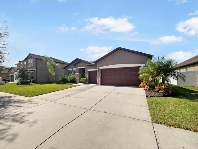 ranch-style home with a front yard and a garage