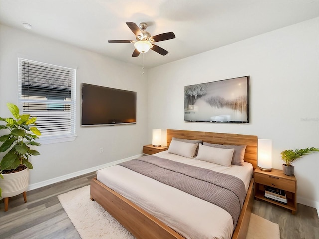 bedroom featuring wood-type flooring and ceiling fan