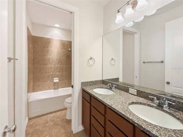 full bathroom with vanity, toilet, tile patterned floors, and tiled shower / bath