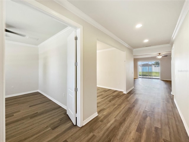 hall featuring crown molding and dark hardwood / wood-style flooring