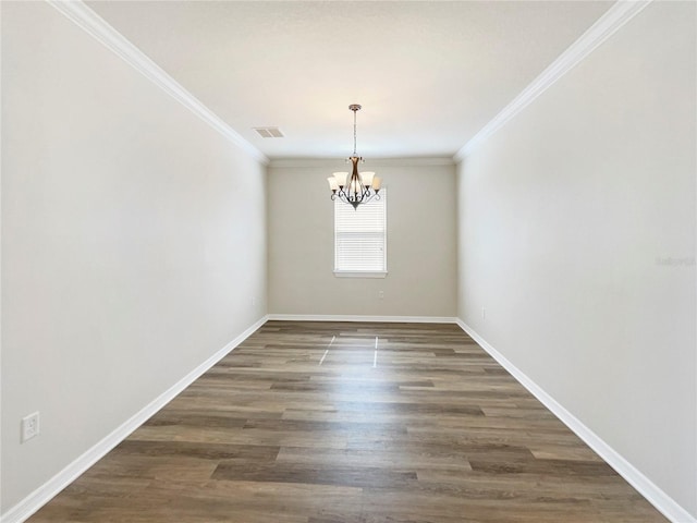 empty room featuring crown molding, a chandelier, and dark hardwood / wood-style flooring