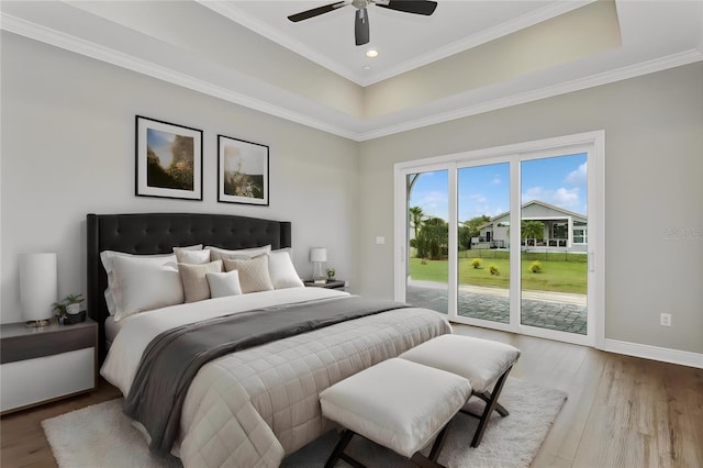 bedroom featuring hardwood / wood-style flooring, ceiling fan, access to exterior, and ornamental molding