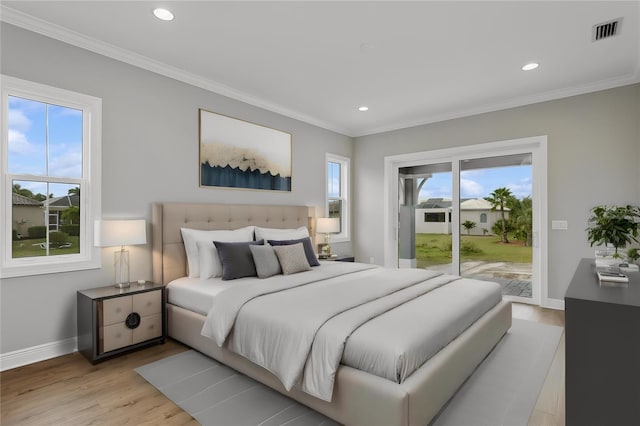 bedroom with access to exterior, crown molding, and light hardwood / wood-style flooring