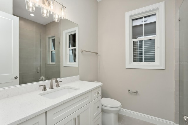 bathroom with toilet, vanity, tile patterned floors, and walk in shower