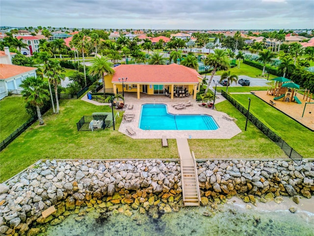 view of swimming pool featuring a patio area and a lawn