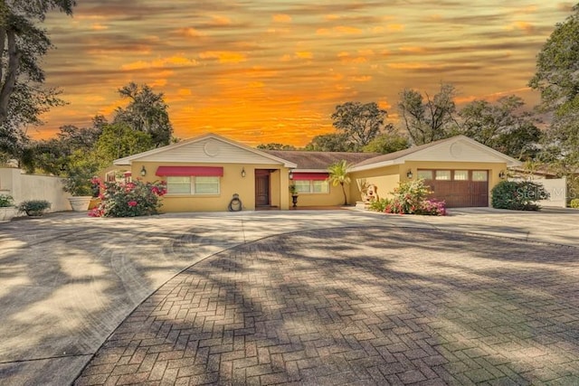 ranch-style home featuring a garage