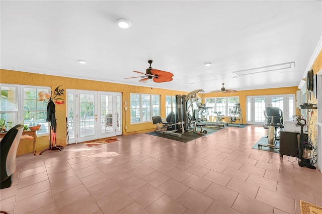 workout area with light tile floors, ceiling fan, and french doors