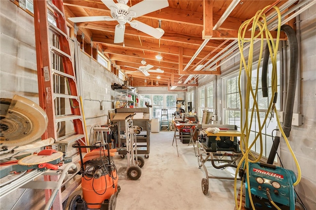 interior space with ceiling fan