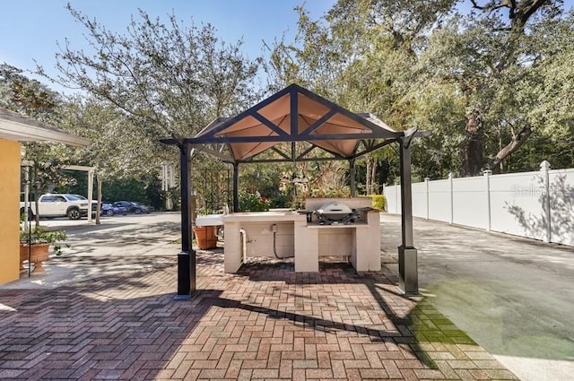 view of patio featuring a gazebo and grilling area