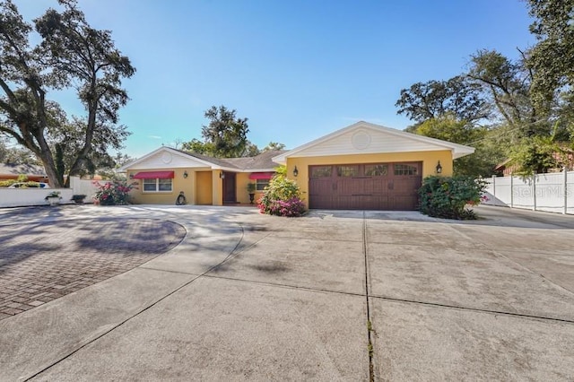 ranch-style house featuring a garage