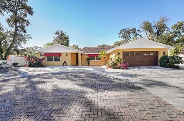 ranch-style home with a garage