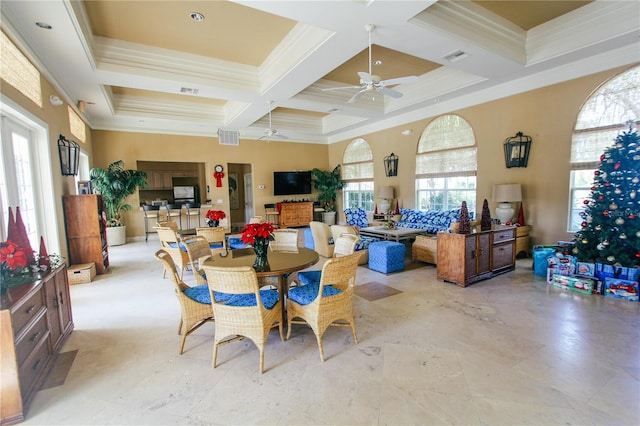 dining area featuring beam ceiling, crown molding, coffered ceiling, and ceiling fan
