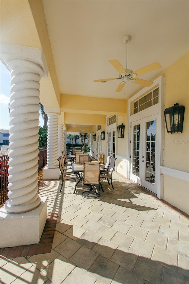 view of patio featuring french doors, outdoor dining space, and a ceiling fan